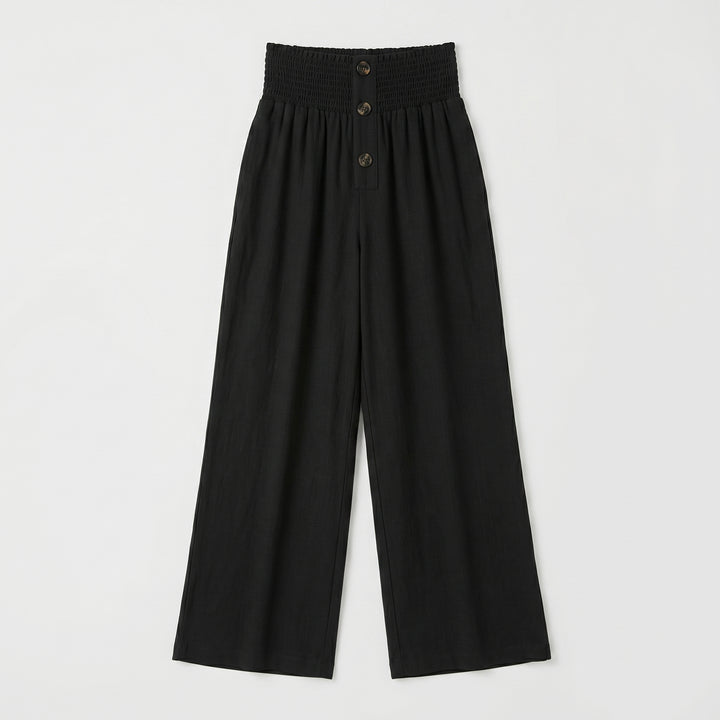 Schwarze Palazzo-Hose mit Smockbund und Knöpfen, Flat-Lay