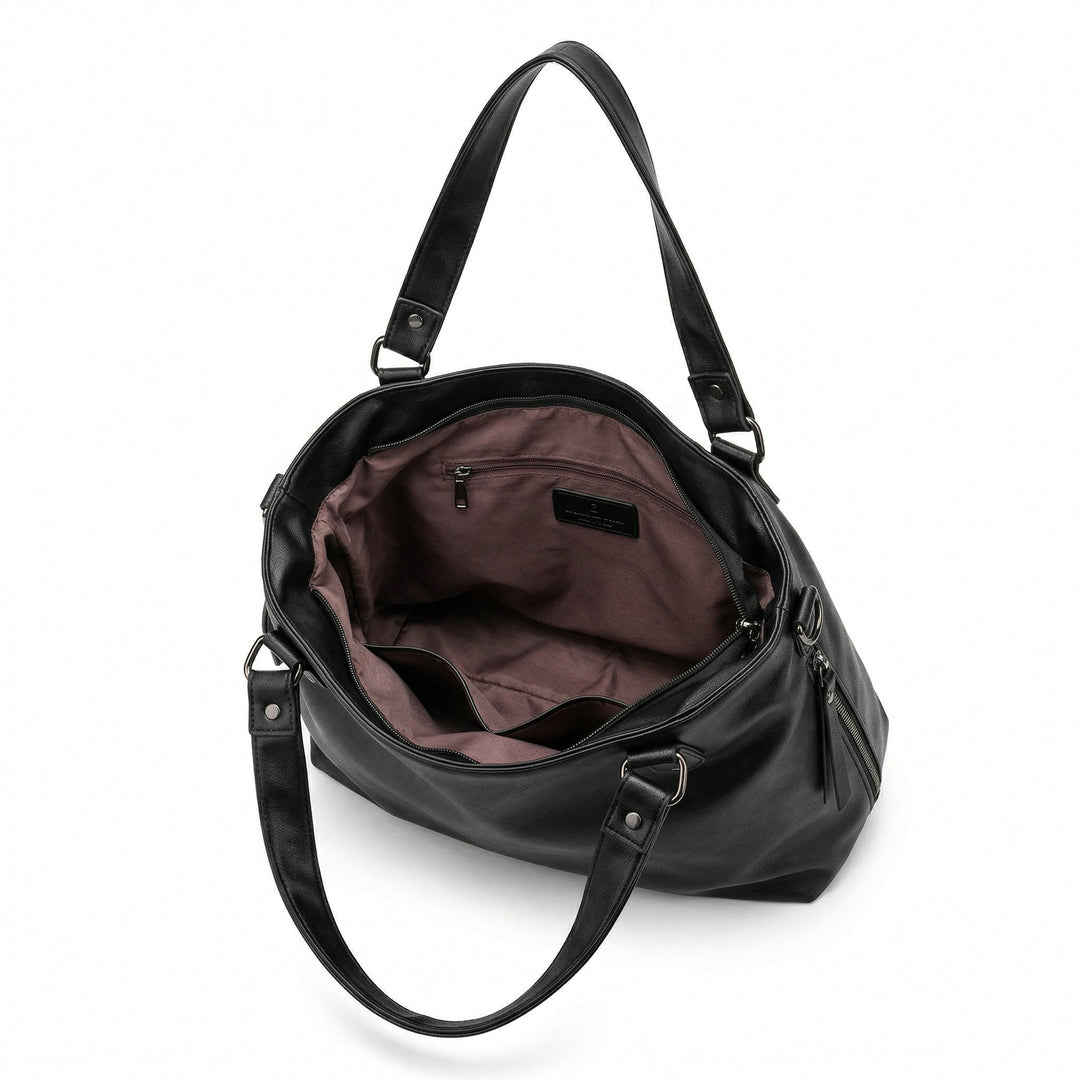 Innenraum der schwarzen Hobo-Tasche mit altrosa Futter und Reißverschlussfach