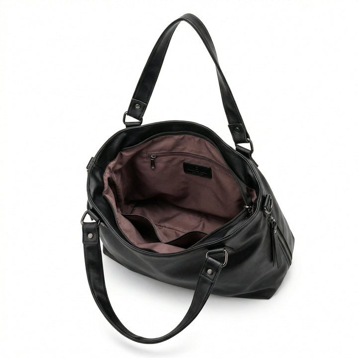 Innenraum der schwarzen Hobo-Tasche mit altrosa Futter und Reißverschlussfach