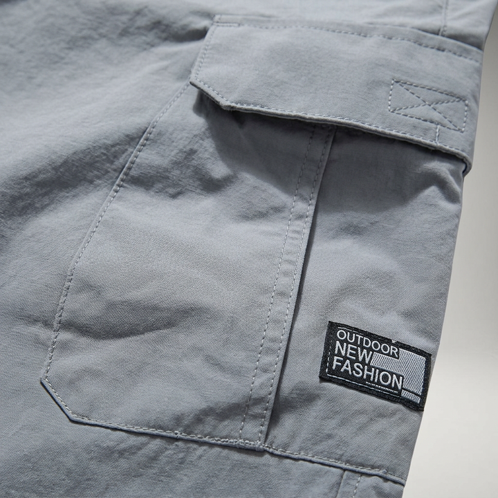 Cargo Shorts Herren Grau, Detailaufnahme Seitentasche mit Reißverschluss