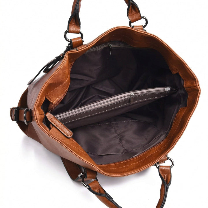 Innenansicht Schultertasche, dunkelgraues Futter mit Reißverschlusstasche und Fächern