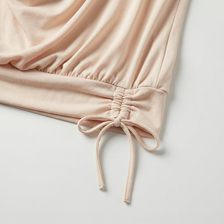 Nahaufnahme seitlicher Raffsaum mit Schleifenband, Beige